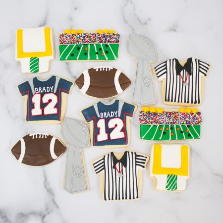 These Football Cookies for the Super Bowl are the most delicious sugar cookies topped with royal icing. This post shares which royal icing colors are used and which cookie cutters! They are so FUN!